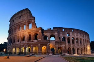 Colosseum exterior Rome ; lit up in the evening.