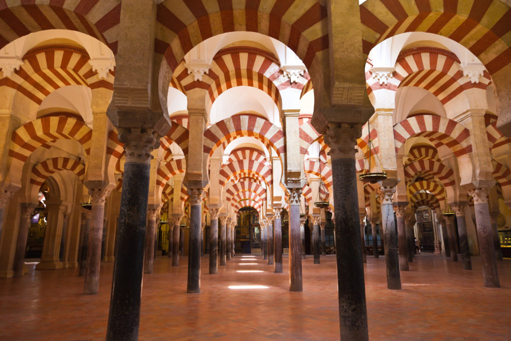 Moorish architecture of the praying hall. The Mezquita is regarded as the most accomplished monument of the Umayyad Caliphate of Córdoba. After the Spanish Reconquista, it once again became a Roman Catholic church.