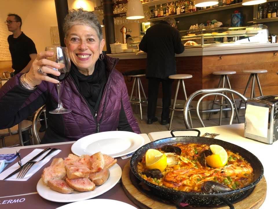 Picture of Liz Reding, the guest poster with a meal in Spain