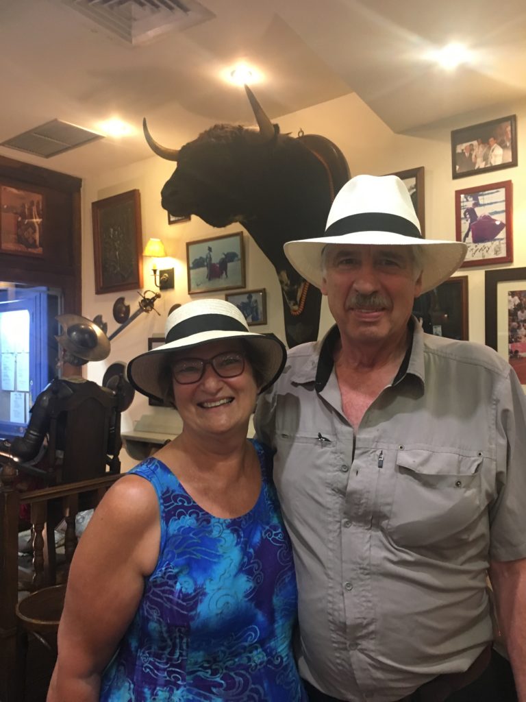 Carol Cram & Gregg Simpson in Toledo, Spain. These two independent travelers love seeking out small, family-fun restaurants to enjoy local cuisine.