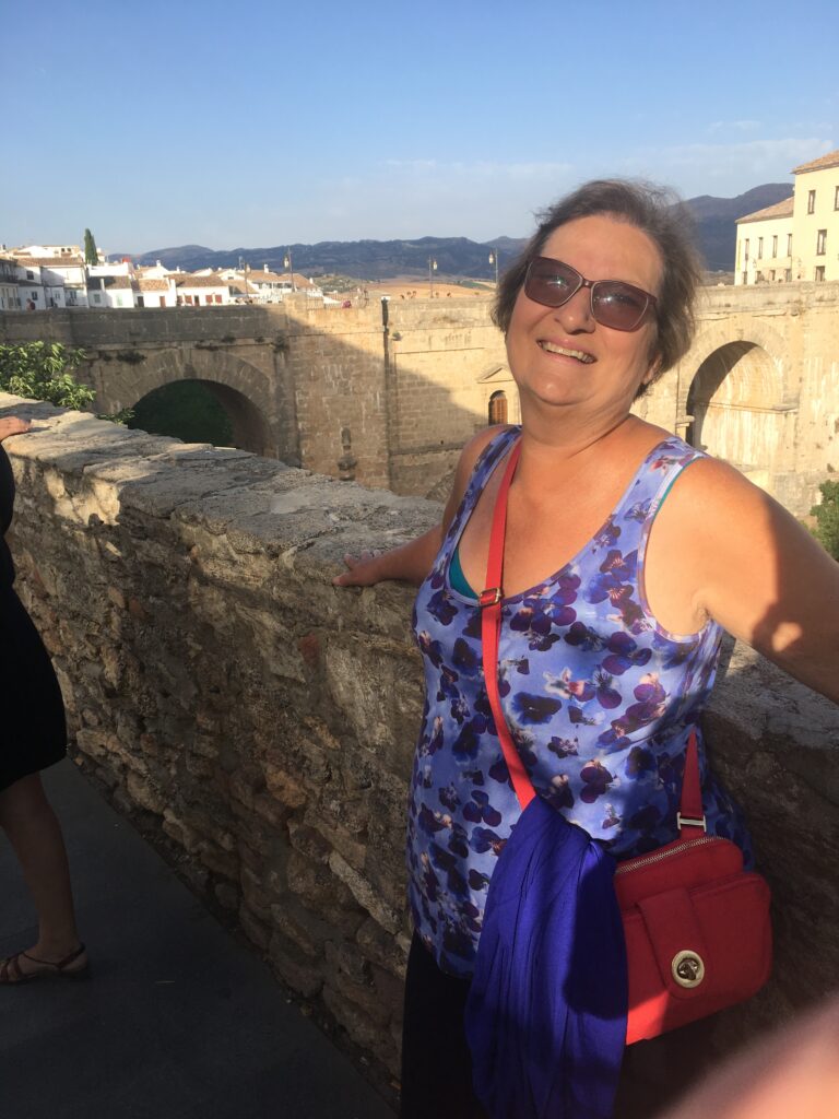 Carol Cram on the bridge at Ronda, a highlight of touring Andalusia