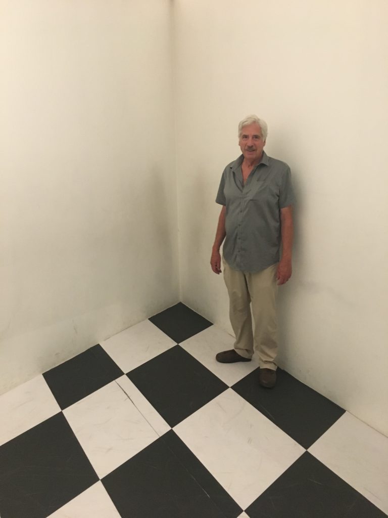Gregg Simpson in an otpical illusion room at the Escher exhibition in Porto