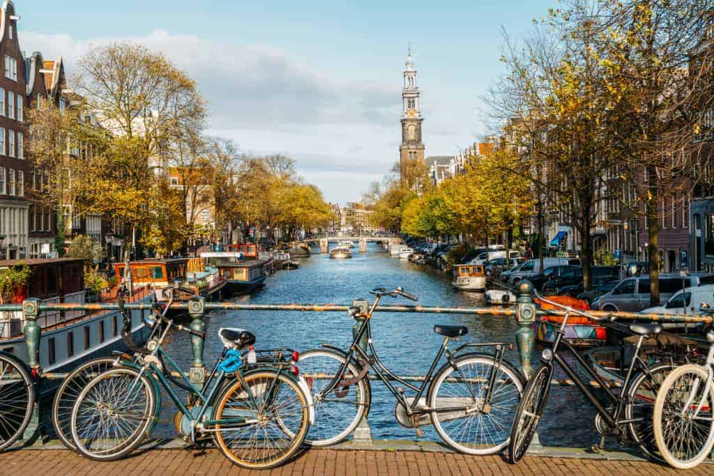 Bikes on a bridge, Amsterdam; cycling is green travel at its finest!
