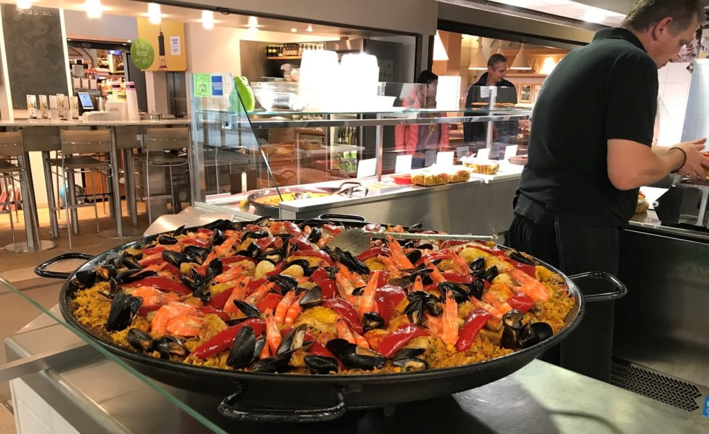 Huge pot of paella at a food stall in Les Halle de Lyon