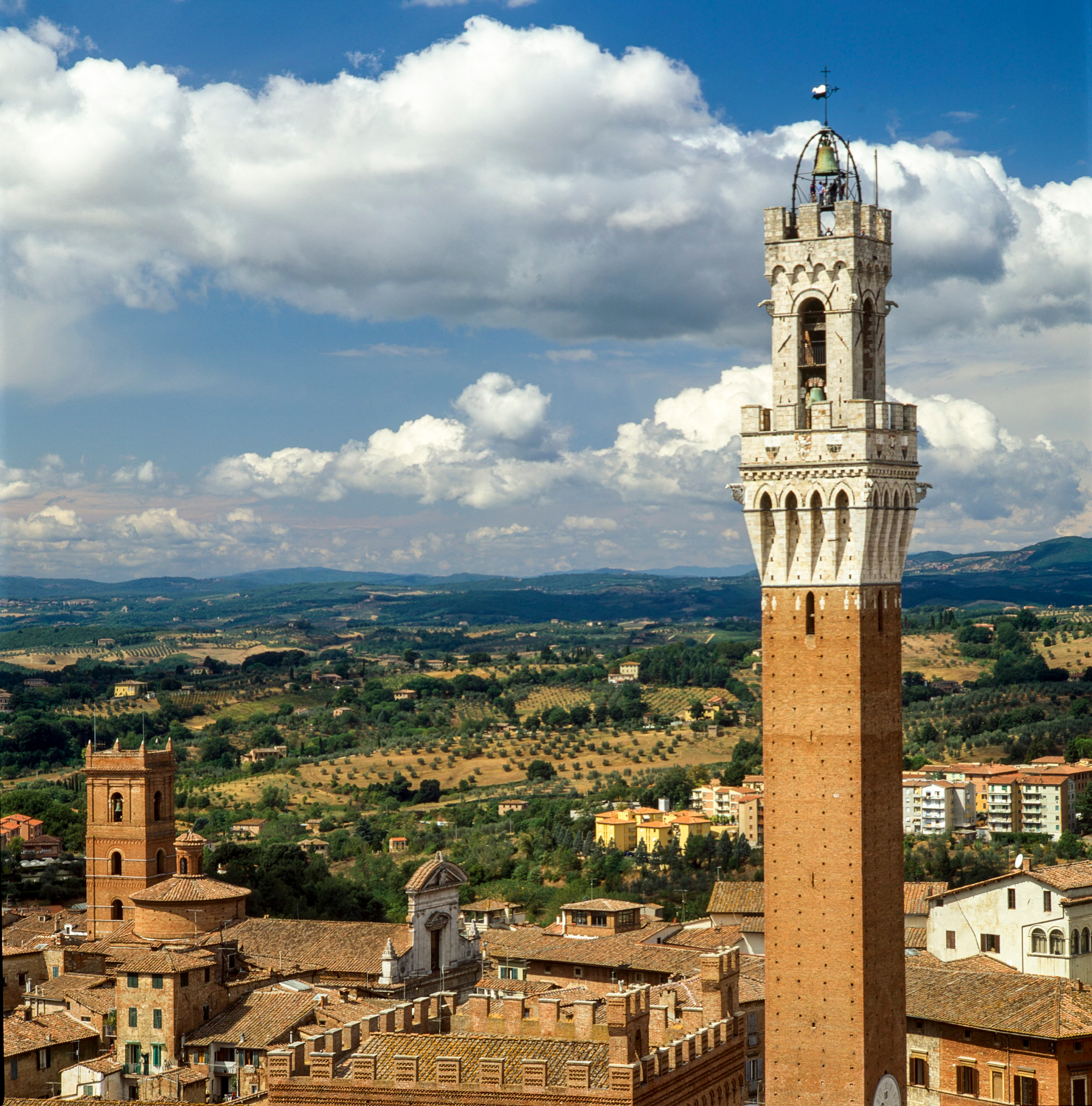 Siena, Tuscany, Italy - Aerial' landscape of the city' center from the top of the Museo dell'Opera del Duomo with Torre Mangia.