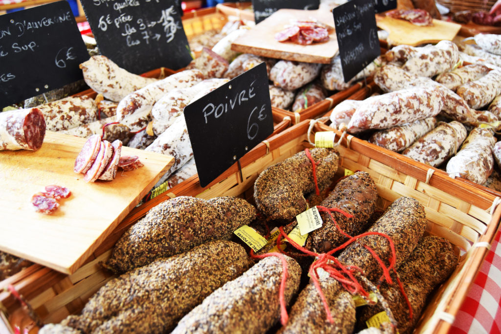 Selection of sausages (saucisson) at a market in France. Buying picnic food in local markets is one of the many pleasures of visiting France.