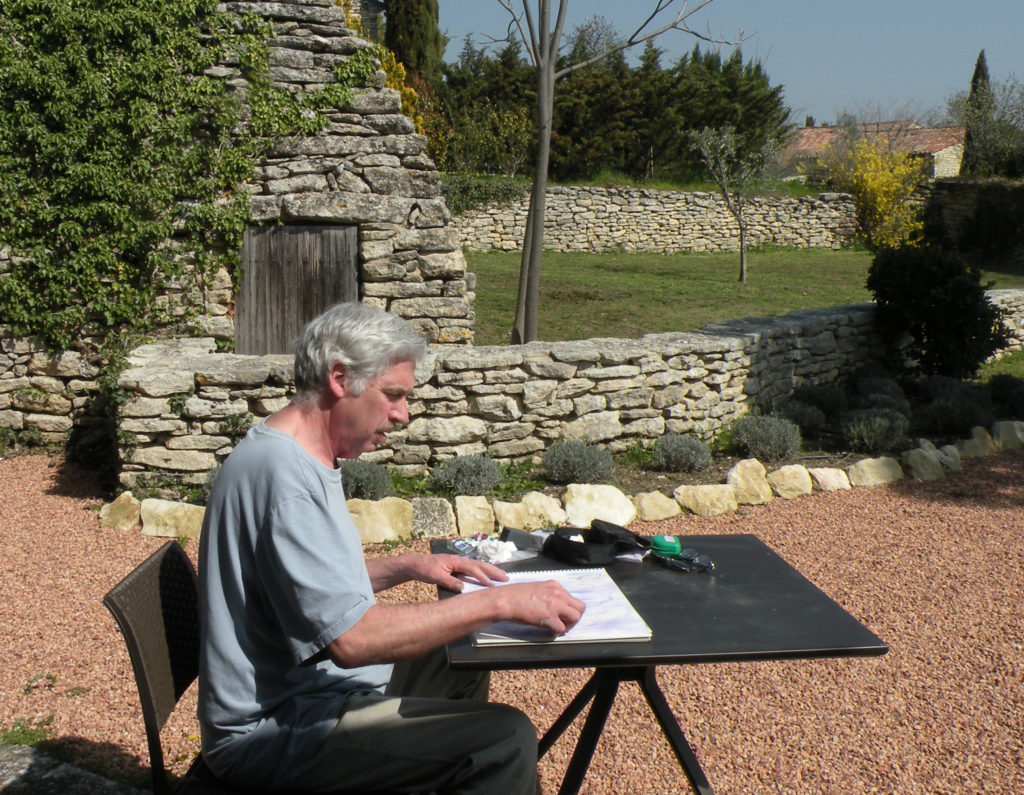 Gregg Simpson drawing on the terrace of a hotel in Provence, France