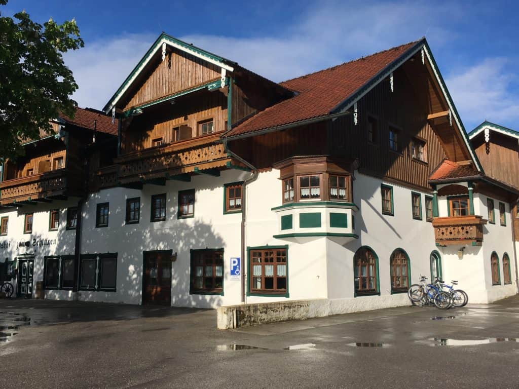 Gutshof zum Schluxen is a family-run, boutique-style hotel in Austria. This image shows the exterior of the hotel.