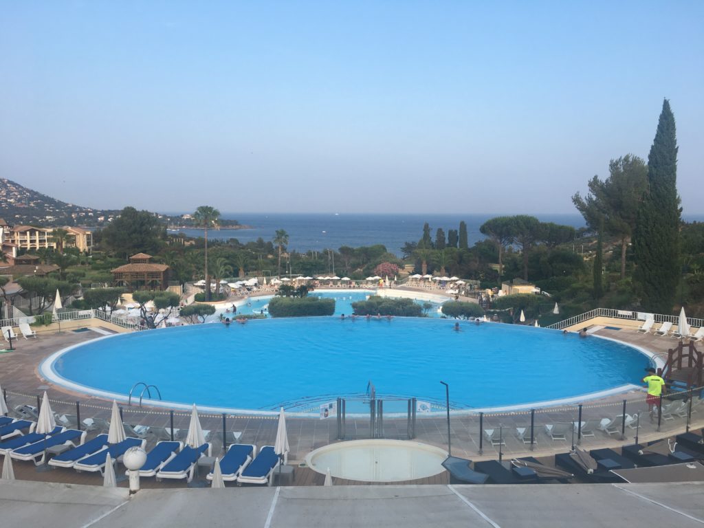 Swimming pools at a holiday village in the south of France overlooking the Mediterranean