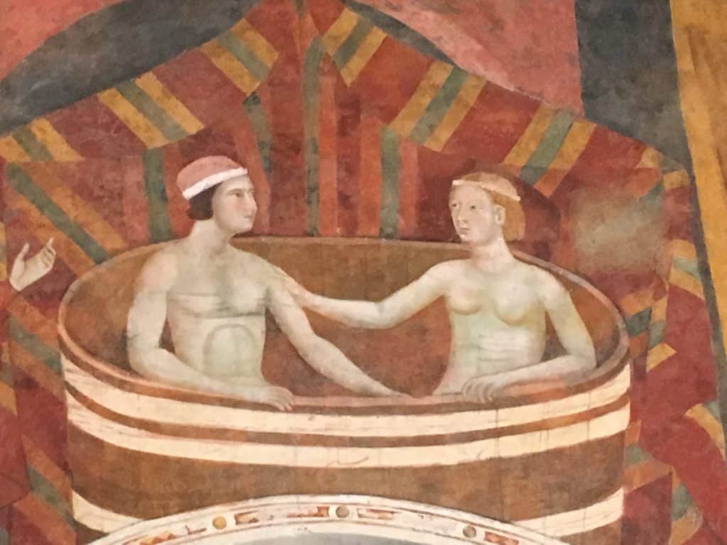 One of the frescoes in the Palazzo Communale Civic Museum in San Gimignano showing a naked couple enjoying a bath.