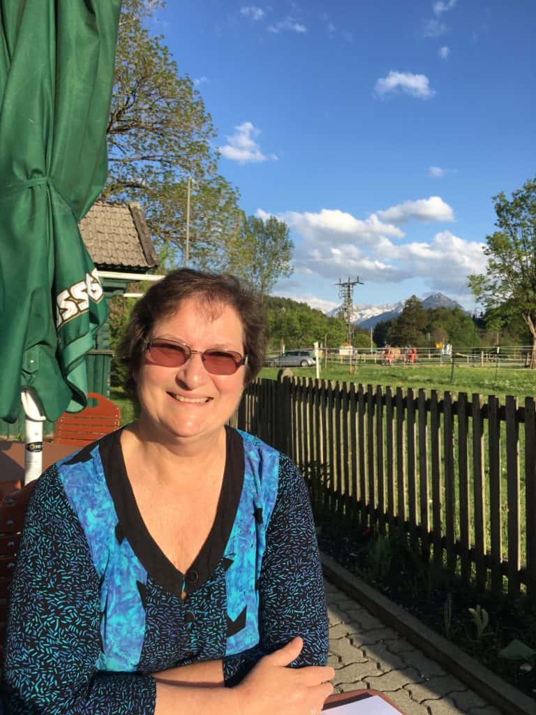 The author Carol Cram sitting on the terrace at the Gutshof zum Schluxen in Austria