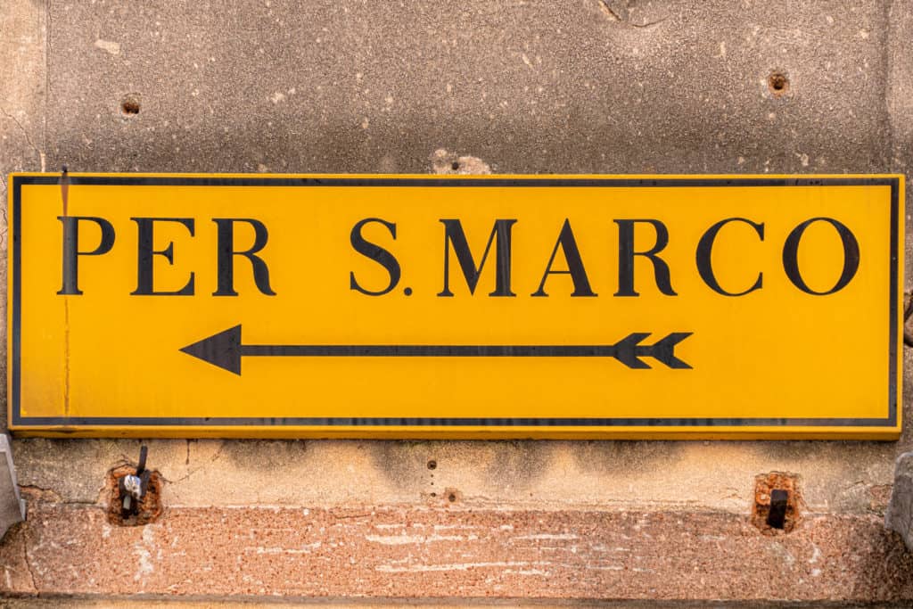 Sign pointing to San Marco in Venice