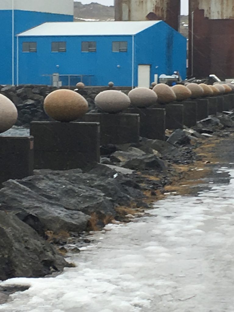 Art installation of different granite eggs in Eastfjords village in Iceland
