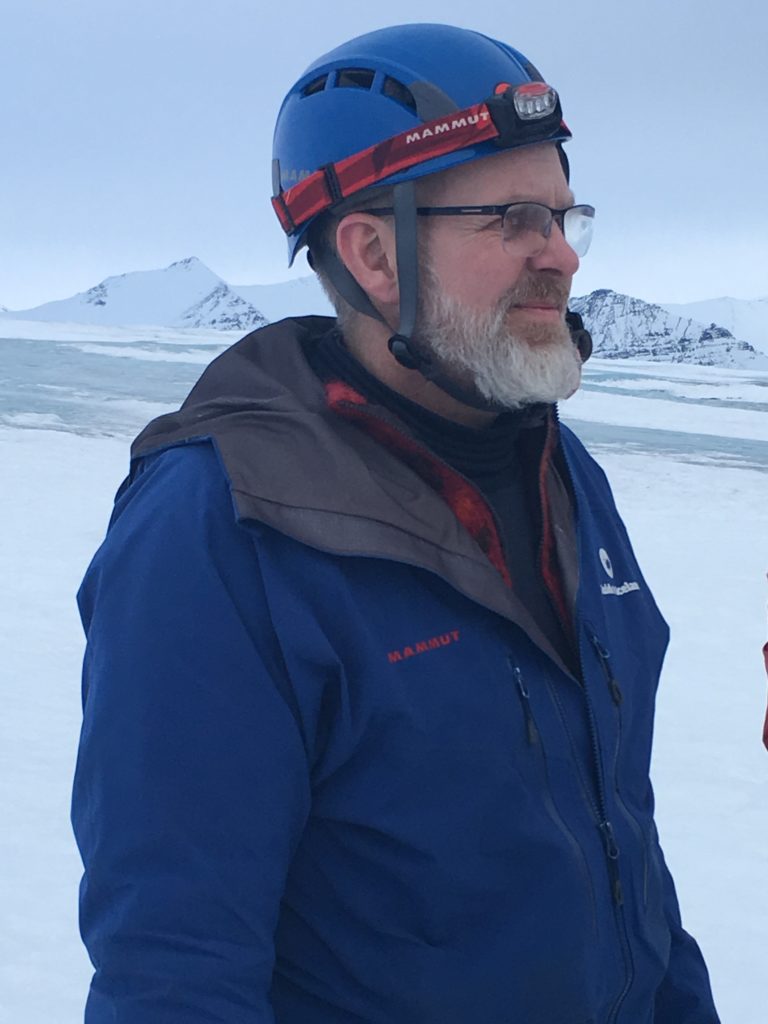 Guide on the glacier at the ice caves in Iceland