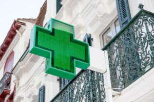 Green cross representing a pharmacy in Europe