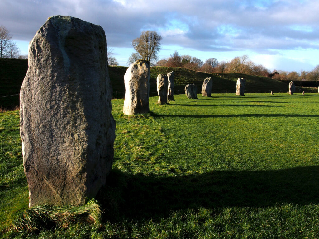 Standing stones at Avebury, one of seven recommended prehistory sites to visit while traveling in Europe
