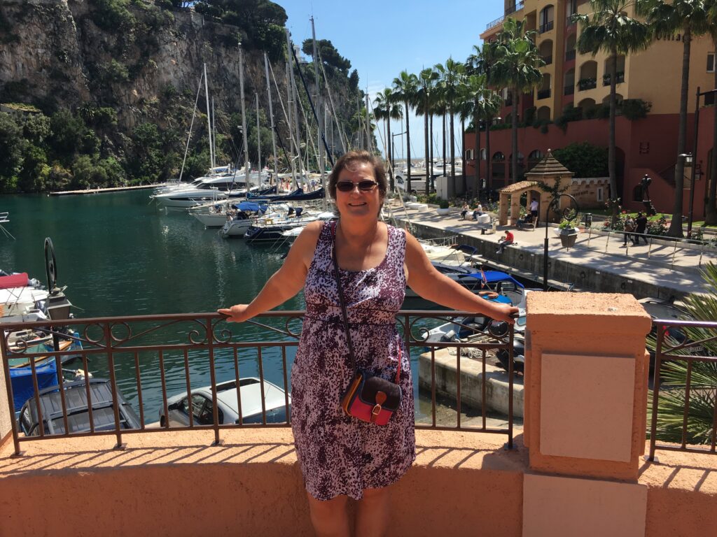 Carol Cram overlooking an interior harbor near the old town in Monaco