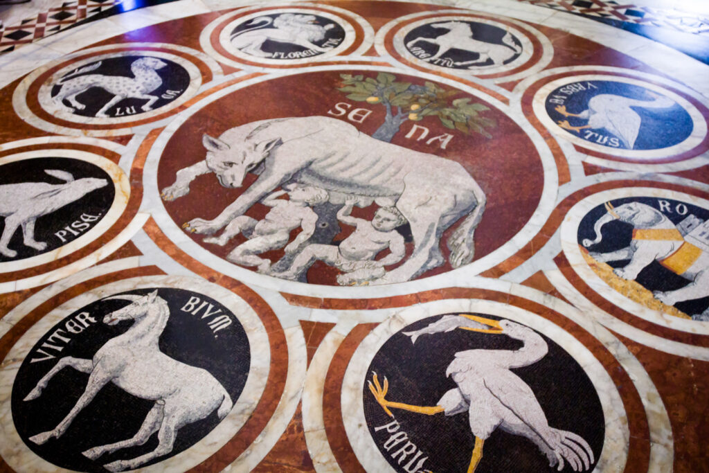 A panel in Siena Cathedral's Floor showing the She-Wolf of Siena dating from 1373 