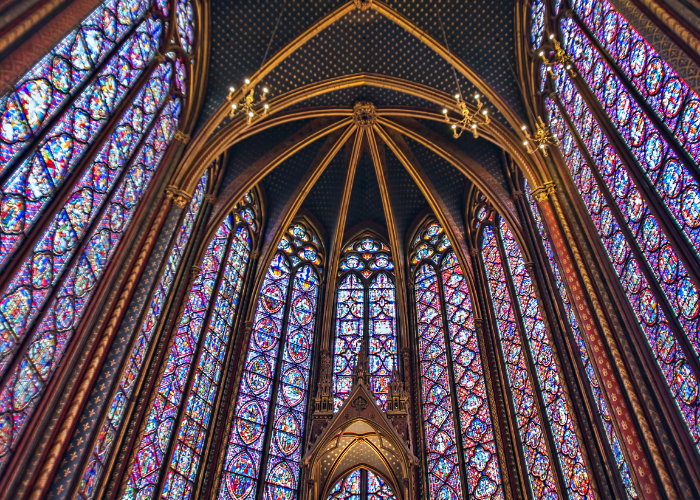 The soaring stained glass windows on the second level of Sainte-Chapelle in Paris, France