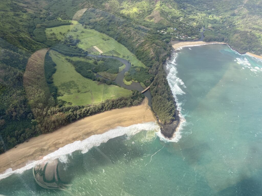 View of sandy beaches and turqoise water as seen from the air on a helicopter ride over Kauai