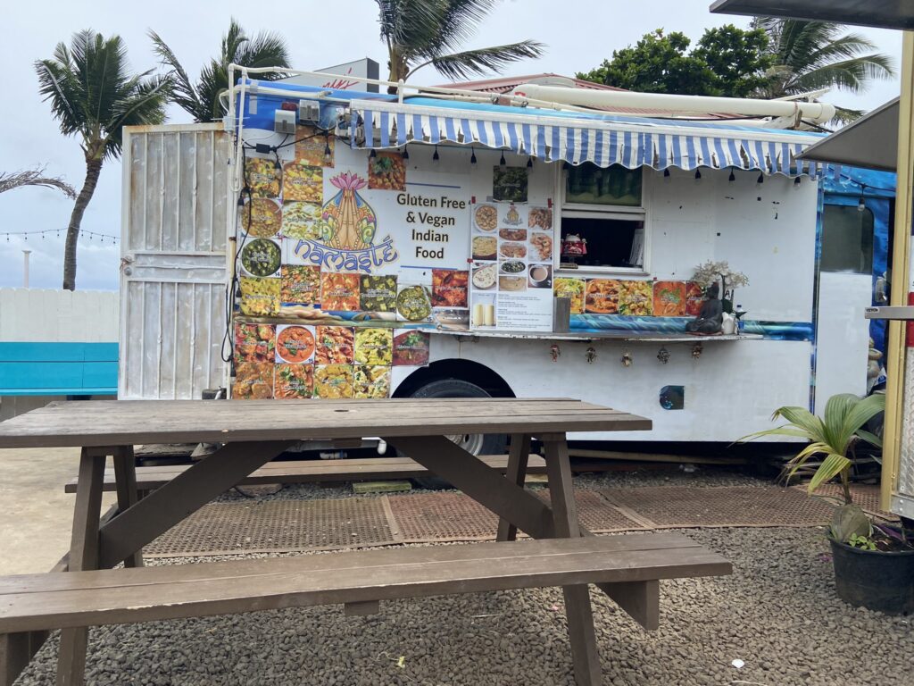 Food truck serving Indian Food near the beach in Kaapa in Kauai. Food trucks are easy and convenient options for solo travelers.
