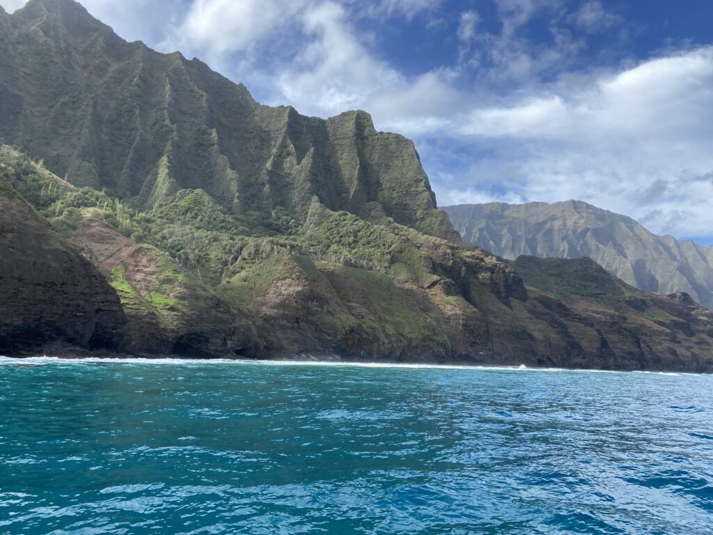 View of the Napali coast from a boat tour with Napali Sea Breeze Tours--a highlight of a Kauai vacation.
