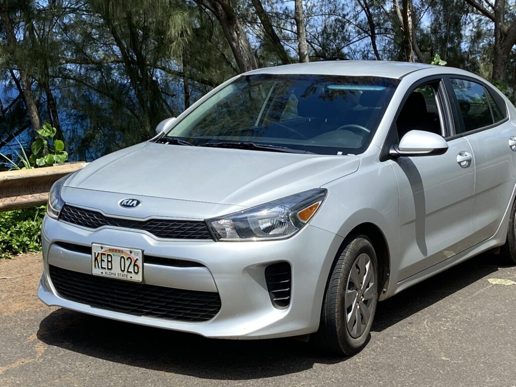 A silver Kia car the author drove all over Kauai. Compact and easy-to-drive, a good choice for the solo traveler.