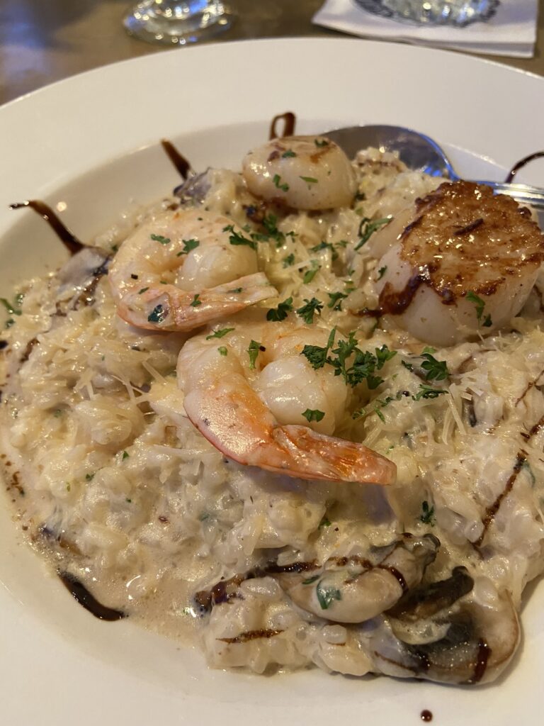 Seafood risotto - creamy and studded with scallops, prawns, and fish