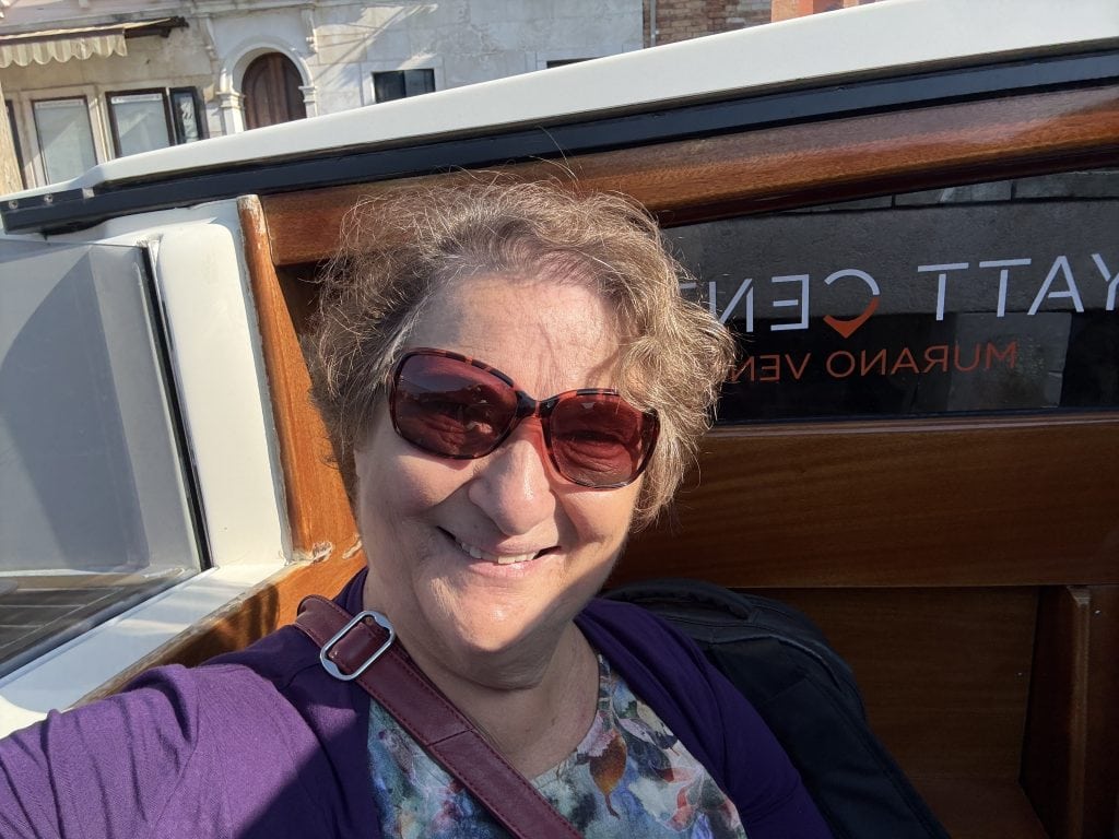 The author, Carol Cram, riding on a water taxi.