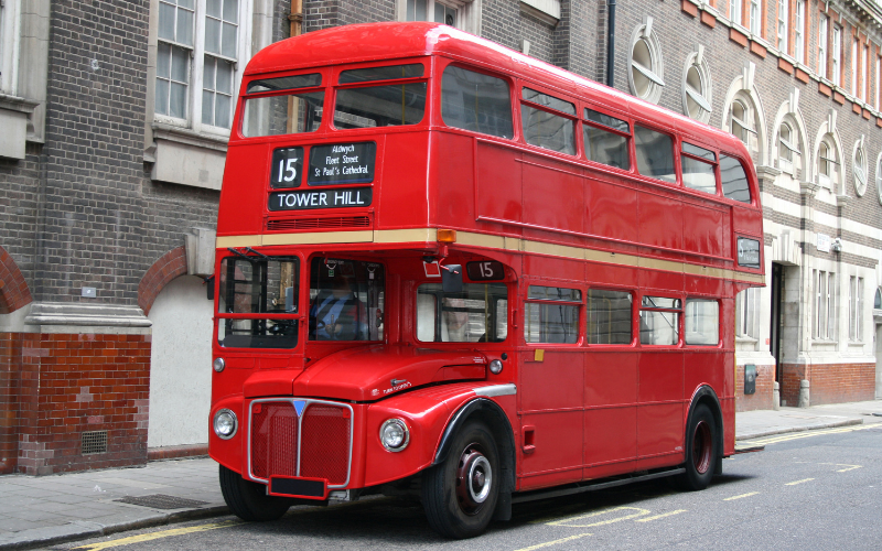 Double-decker red bus in London; taking busses is green travel