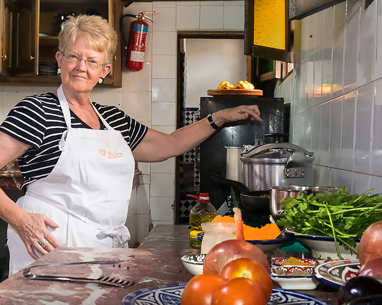The author, Julie Ferguson, pictured in a kitchen in a private cooking class in Fez, Morrocco.