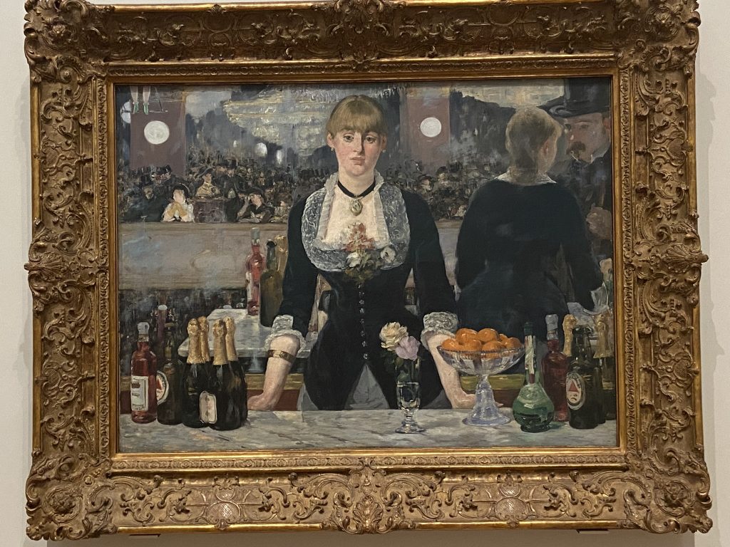 The Bar at the Folies Bergeres by Edoaurd Manet included in the Impressionist collection at the Courtauld Gallery in London.