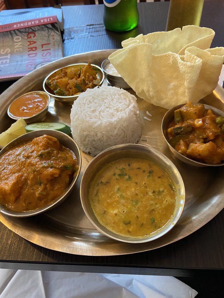 Thali dinner consisting of various curry dishes - dining well in Europe.