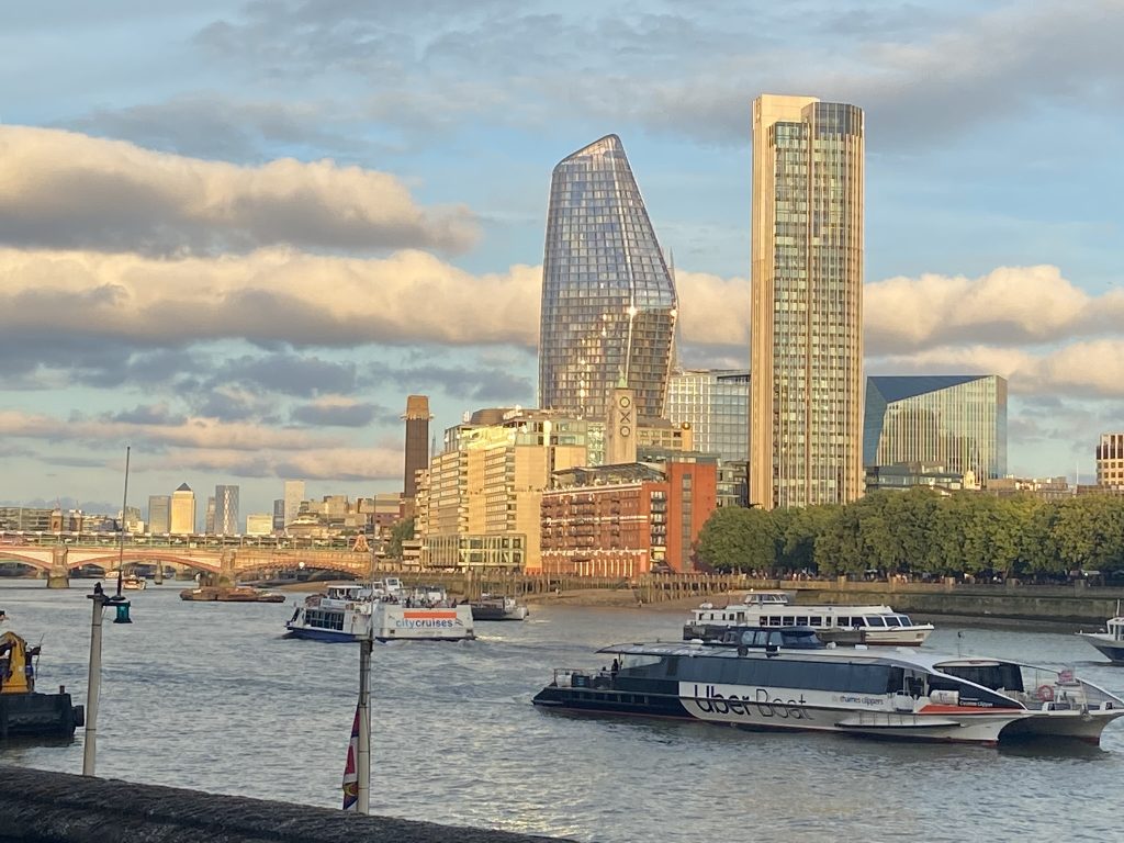 Skyline of London in the early morning sun as seen from the Thames River