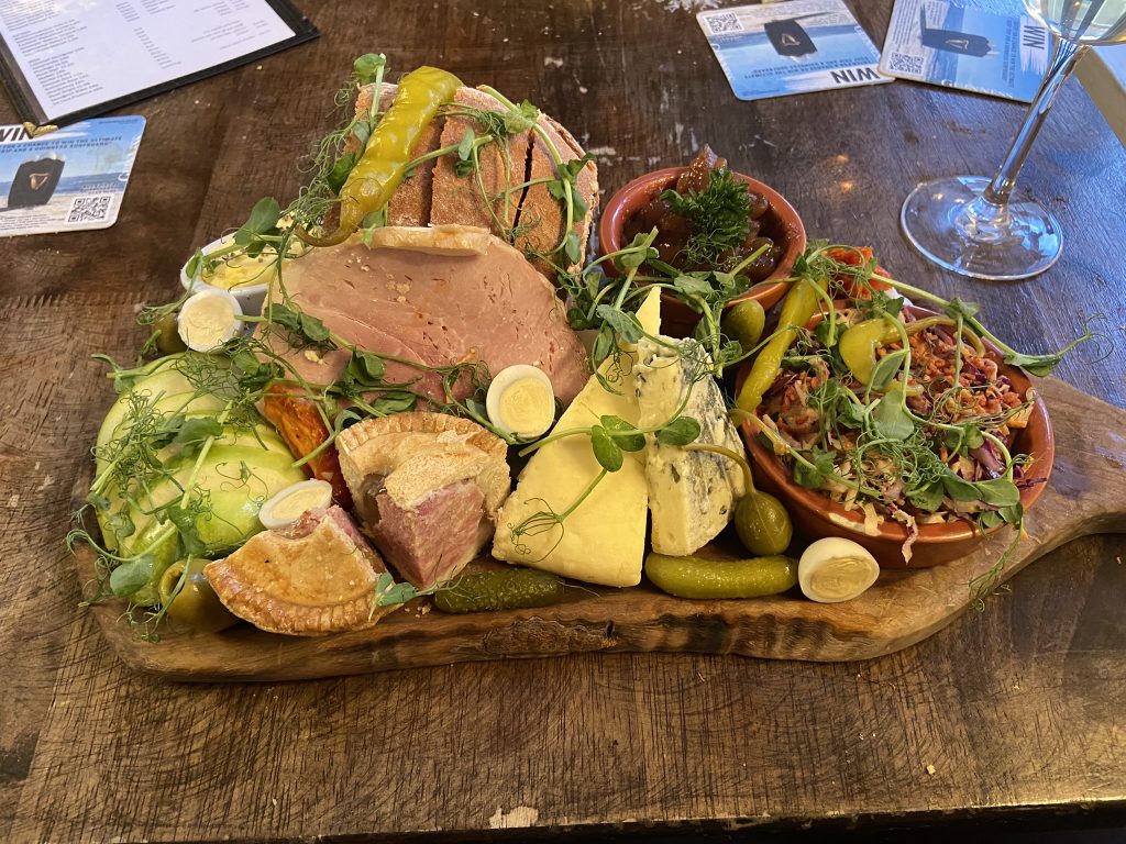 Platter of food - ham, cheeses, pickles