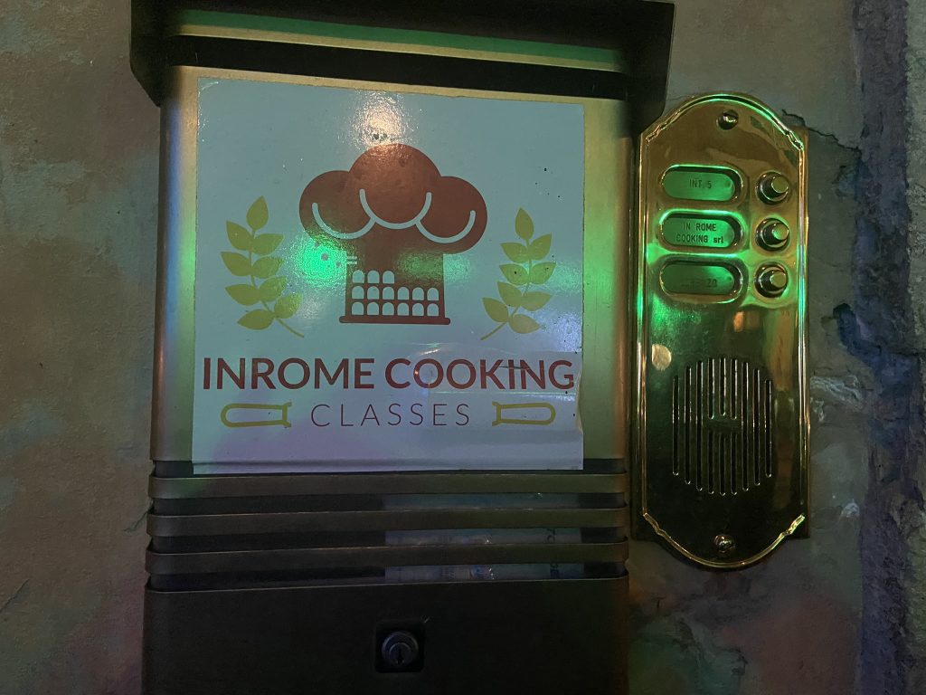 View of the InRome Cooking sign at Corso del Rinascimento, 65 in Rome