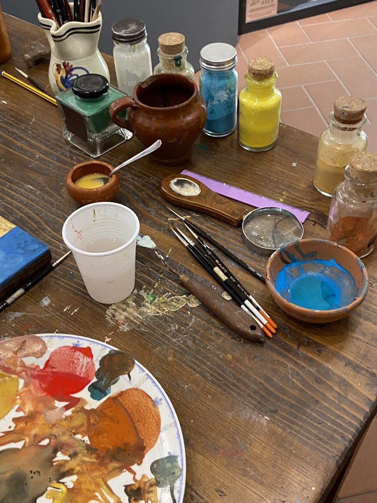 Selection of pigments and brushes and other painting tools in the workshop of Silvia Salvadori