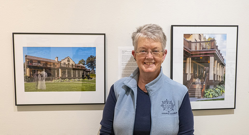 Guest poster Julie h. Ferguson next to photographs she exhibited