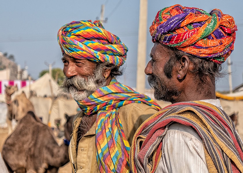 Photograph of two camel traders in Morocco as an example of Travel Photograph Tip 4: keeping the focus point on the subject.