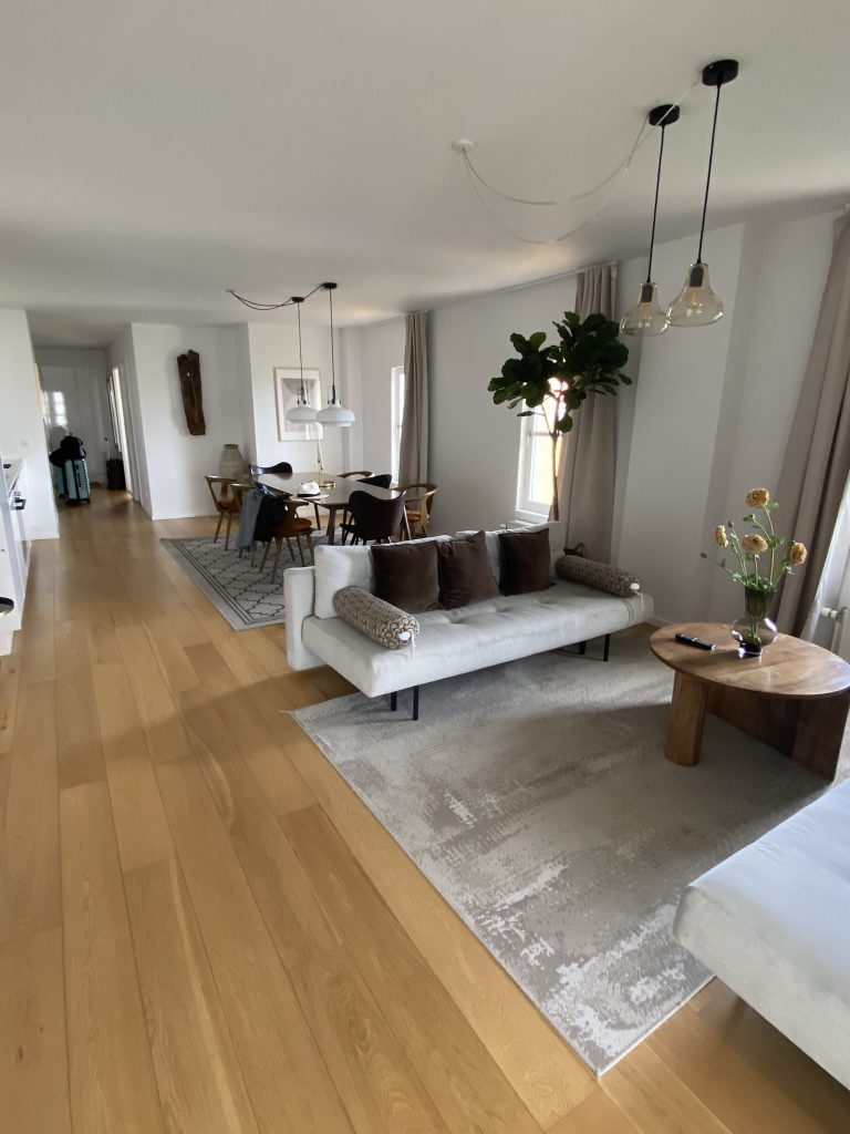 Looking from the living area toward the large dining area in an apartment in Copenhagen