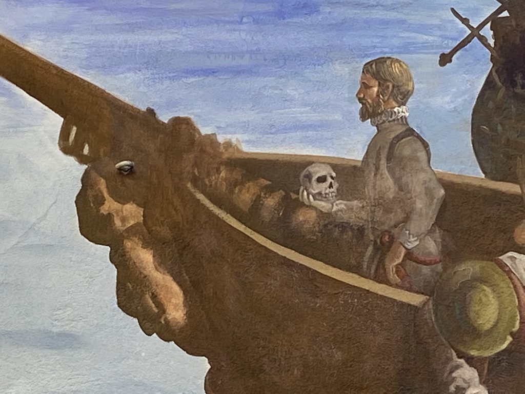 Close-up of Hamlet in the prow of a ship in a mural