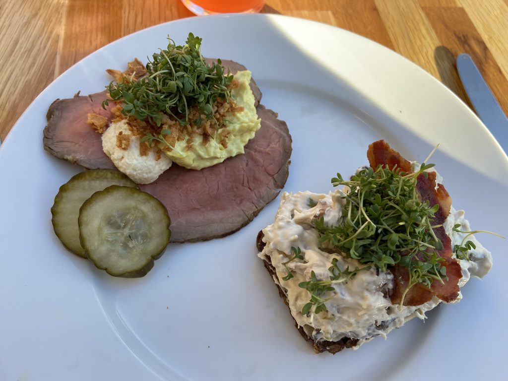Two Smørbrød on a plate, a specialty in Copenhagen