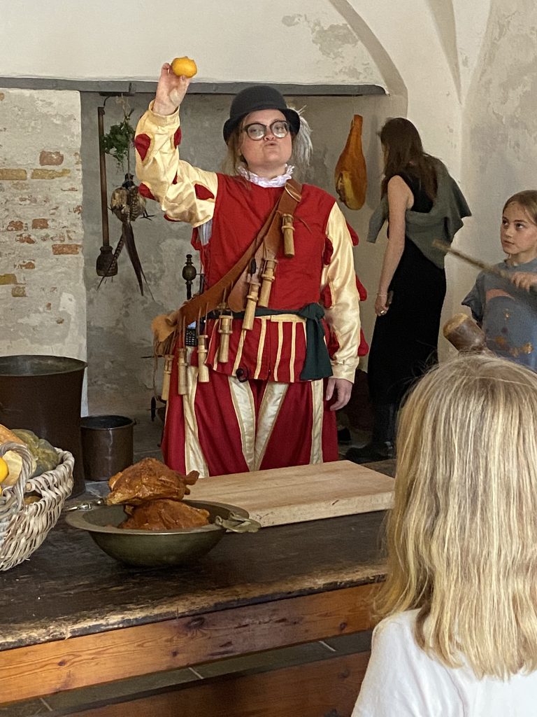 Costumed guide talks about food at Kronborg Castle
