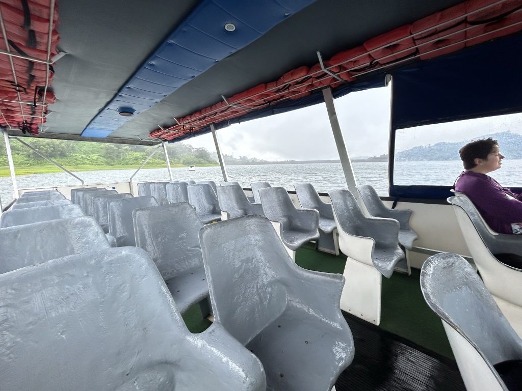 Empty boat crossing Lake Arenal in Costa Rica