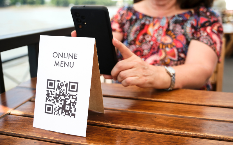 QR codes at restaurants provide you with English translations when dining on a budget in Europe.