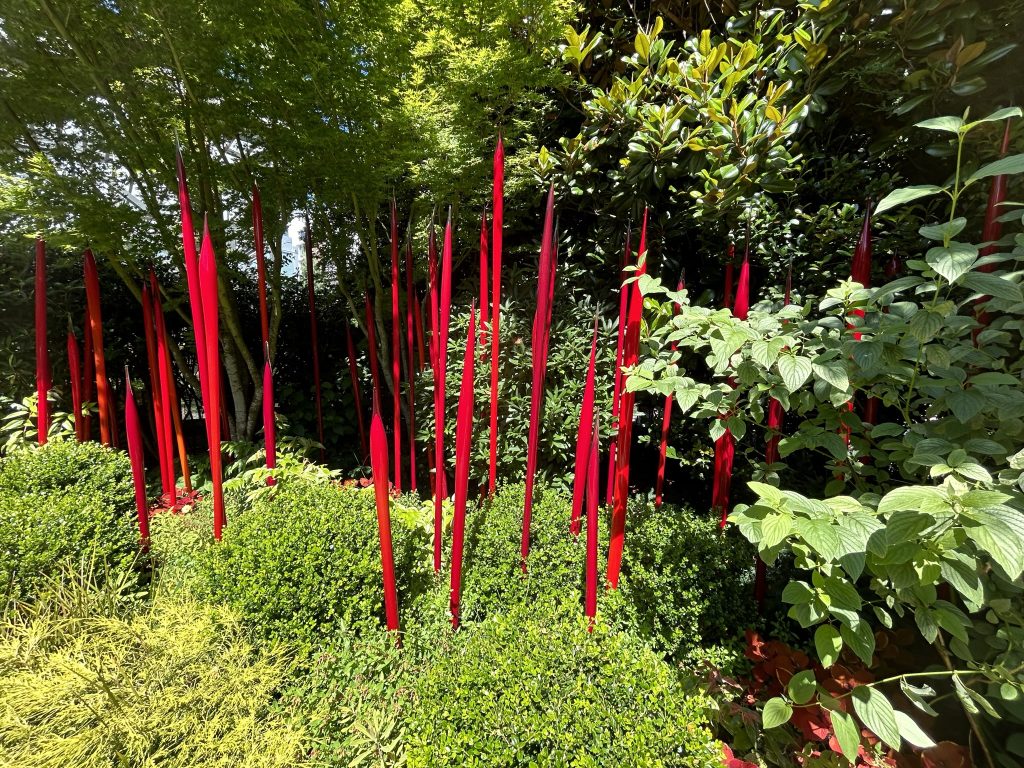 Thin red glass tubes in the garden at Chihuly Garden and Glass in Seattle