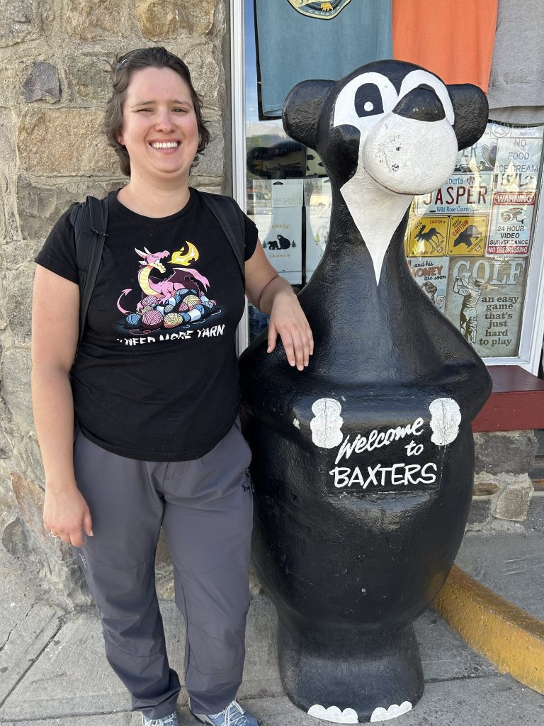 Julia Simpson with Jasper Bear statue in Jasper, Alberta