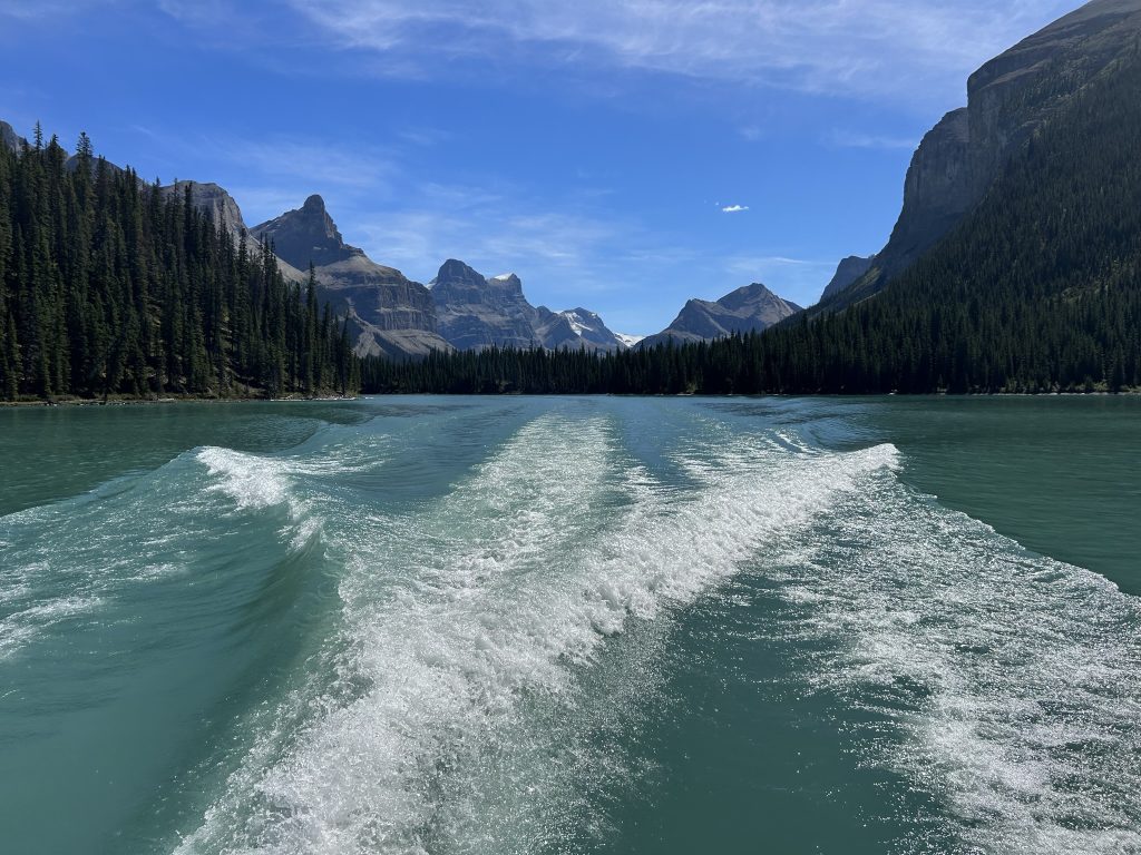 View from the back of the boat as we leave Hall of the Gods to cross Maligne Lake in Jasper National Park