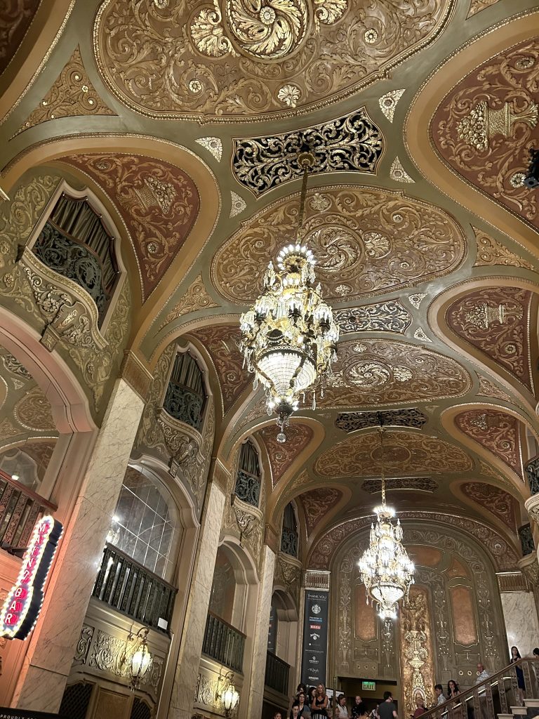 Elaborate gold interior ceiling with chandeliers in the lobby of the Paramount Theater in Seattle