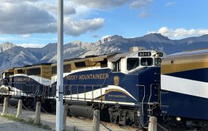 Engine of the Rocky Mountaineer train with a backdrop of mountains in Jasper Alberta